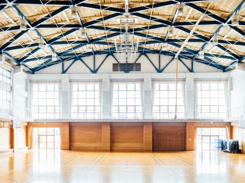 Large school gymnasium that needs a lot of air cleaning when full of people.